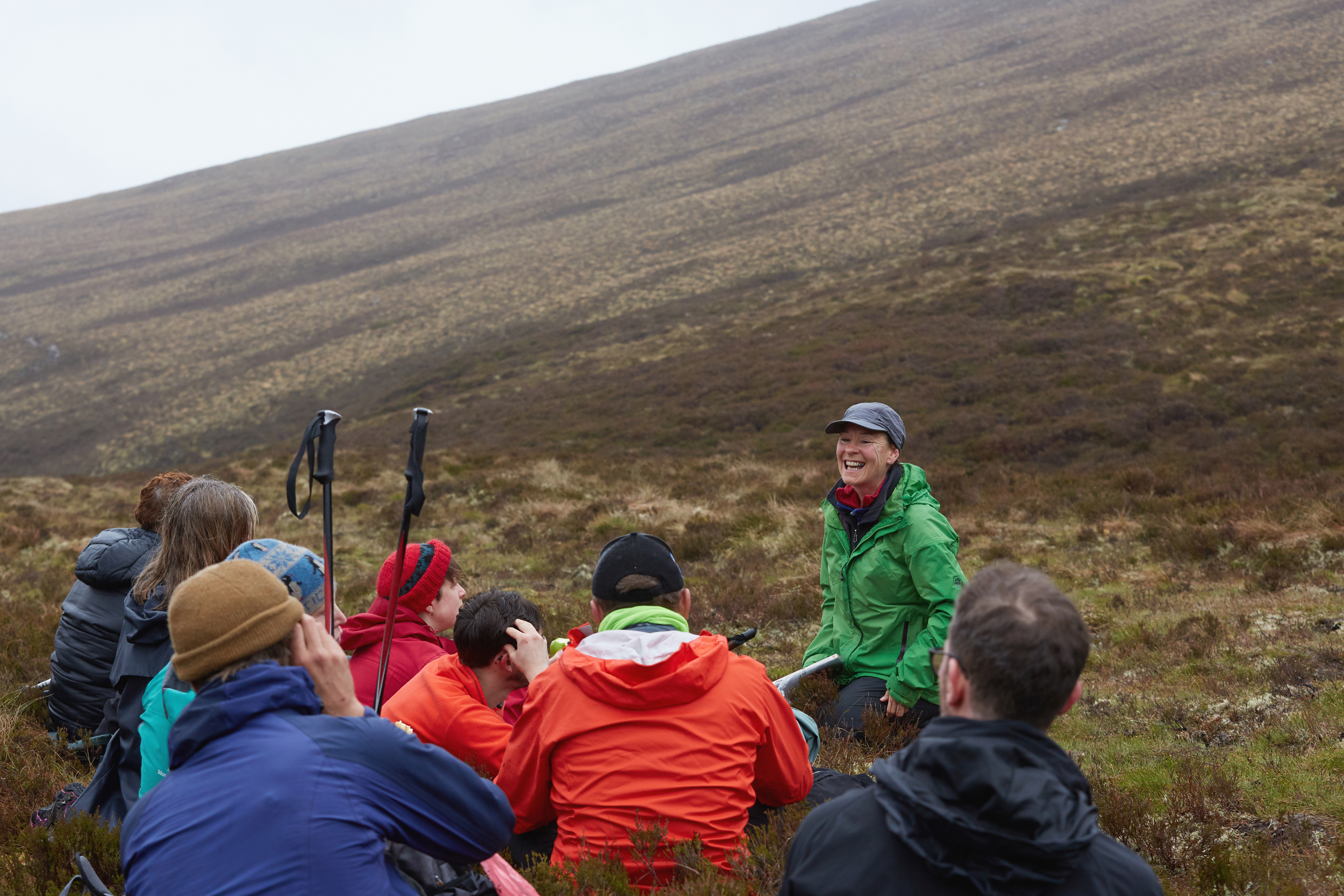 Mountain leader speaks to a group from within the Cairngorms